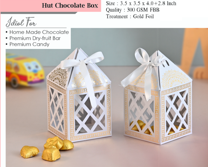 decorative chocolate boxes with gold foil on a neutral background